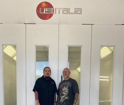 two-men-with-paint-booth